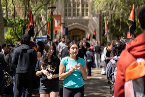 students walk through a crowd